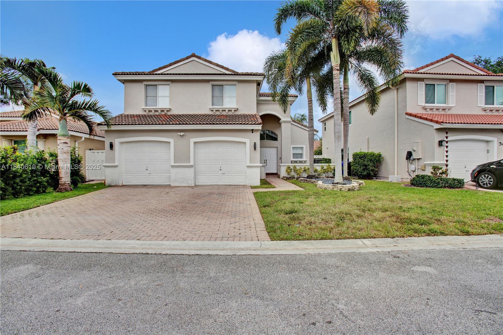 Stunning move-in ready Fully Renovated home in the sought-after security-gated neighborhood of Oakridge. This home is available FULLY FURNISHED. Featuring 4 bedrooms, 2.5 bathrooms, 2 car garage, and a beautiful heated swimming pool with a lake view. Completely renovated with updated appliances, marble floors & modern style interior design, look no further, this home is turnkey. Walking distance to House of Worship, Publix, and I-95, Hardrock Hotel and Casino. Community amenities include Tennis court, children's playground, private security gate, basketball court and more!
