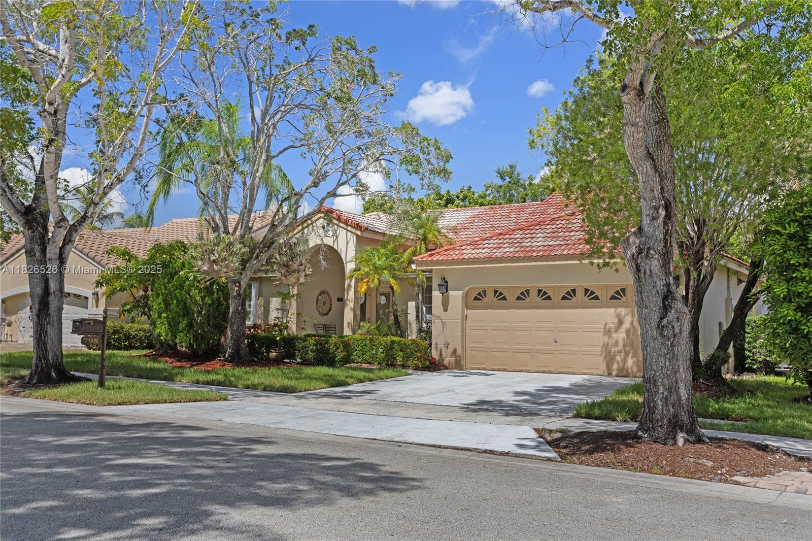 Spacious home in THE LAKES, Weston's Premier Guard-gated community. Incredible layout for a single-story home with 4 bedrooms and 2.5 bathrooms, and nearly 2,500 square feet of air conditioning. Tile flooring throughout the main areas is complemented by warm wood floors in the bedrooms. This house also has a wonderful screened pool next to a canal that exudes tranquility and comfort. Garage for two cars. Accordion Shutters throughout the entire house. New air conditioning unit.