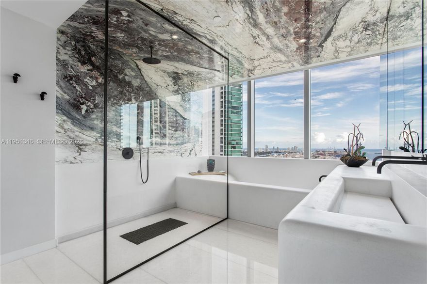 A rare, fully reimagined residence—impossible to replicate at this level. For the buyer who values design, quality, and time, this is unmatched. This is not a standard Paramount residence. The original owner completed a full gut renovation immediately after closing, reconfiguring the layout to enhance scale, flow, and functionality. The result: the only residence in the 11 Line with a true formal dining area, also ideal as a media or billiards space. Designed by top-tier New York and Florida firms, this turnkey home features over $1,000,000 in curated upgrades. Marble floors, sculptural plaster walls with soft transitions, bespoke ceilings with integrated linear air systems, Lutron, Sonos, and dramatic backlit onyx baths create a level of sophistication rarely seen. Offered fully furnished with a private cabana, delivering immediate enjoyment without the time or cost of renovation. Truly one of one.
