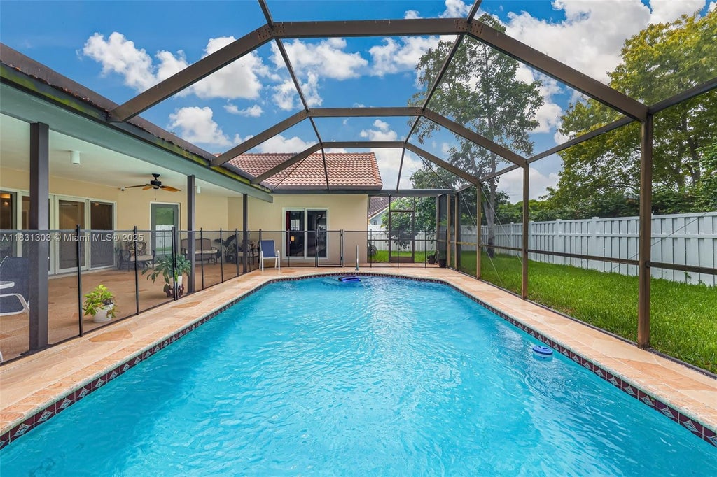 Photo of 10077 N Springs Way, Coral Springs, FL 33076 (MLS # A11831303)