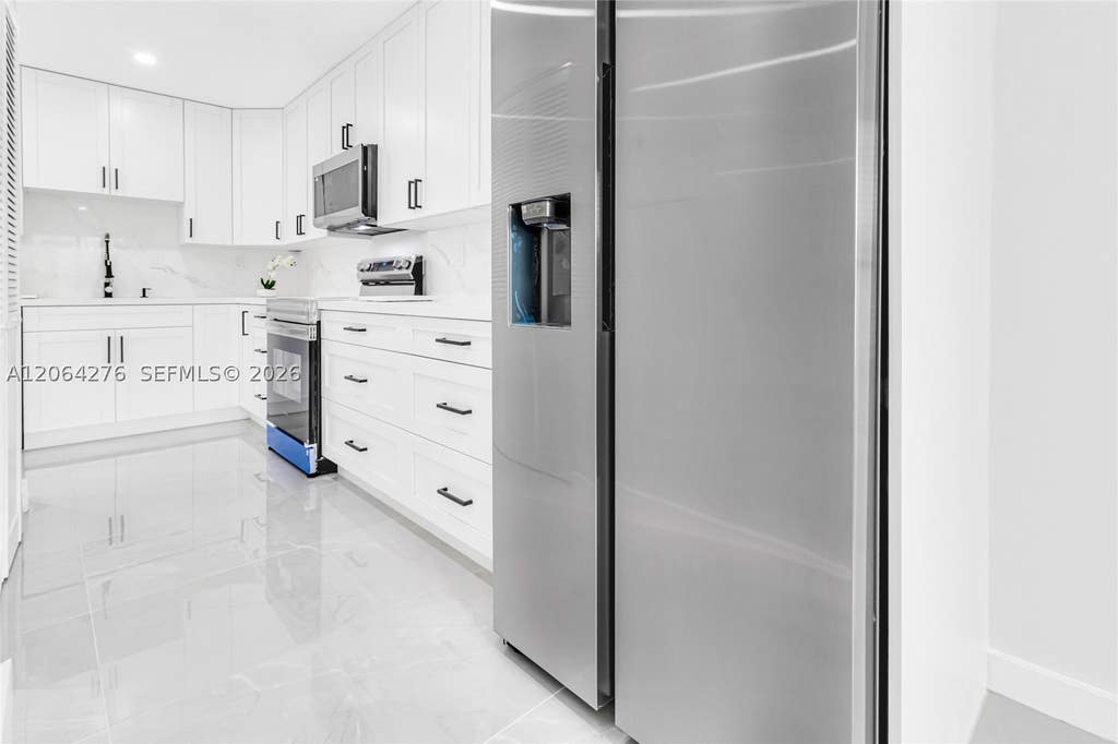 Photo of 8957 NW 44th Ct, Sunrise, FL 33351 (MLS # A12064276)