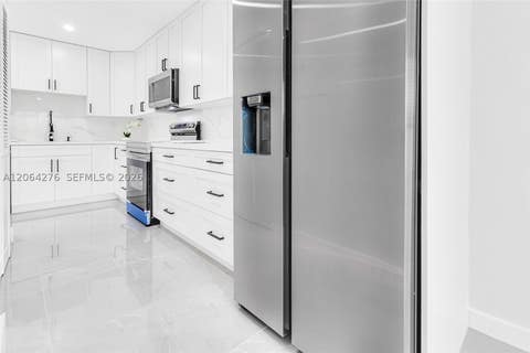 Photo of 8957 NW 44th Ct, Sunrise, FL 33351 (MLS # A12064276)
