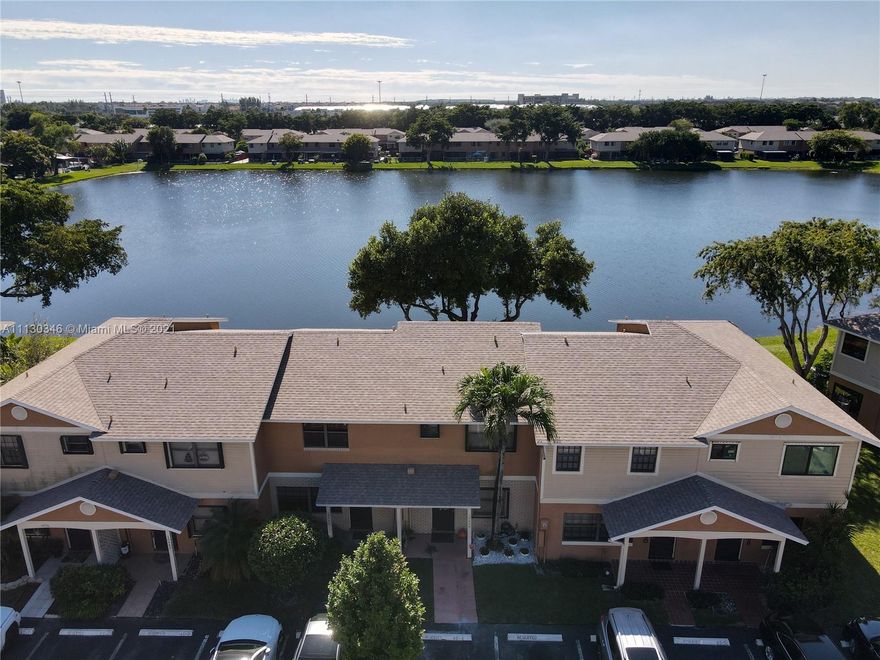 Fully upgraded 2bd/2.5bath Townhouse, with peaceful lakeview. Gorgeous porcelain tile floors thru-out, with amazing natural lighting all around. Track lighting, stainless steel appliances, quartz counter tops, spacious bedrooms, lovely walk-in closet w/ barn sliding doors, linen & pantry closet, large screened patio with direct lake access and BBQ/Picnic area right in your backyard. New Roof, New A/C /Heater, Hurricane impact windows. Roof, Cable, Internet included w/ HOA. Excellent location blocks from Pemb. Lks Mall and multiple shopping centers, Golf Coarses,highways & great schools. Great Investment hm