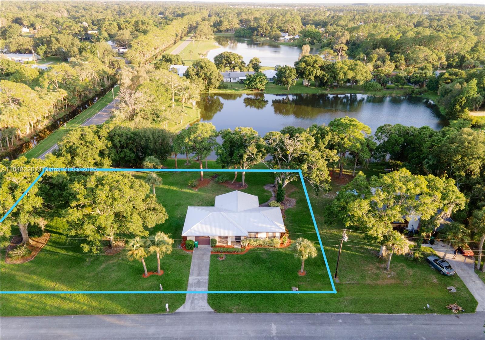 Views, views, views...incredible 3/2 home on a stunning double-sized lakefront corner lot in the highly desirable Lakewood Park neighborhood of Fort Pierce, FL. The 0.54-acre lot was previously 2 folios. The house boasts 3 generously sized bedrooms, 2 bathrooms, an expansive living/dining area, spacious kitchen, and an interior utility room equipped w/ washer & dryer, plus ample storage space. A large, screened patio offers a view of scenic Lake Rose, perfect for entertaining or enjoying peaceful nights. Property can be sold as-is or Seller can finish interiors including flooring, kitchen cabinets & appliances, light fixtures, and paint for negotiable price. New metal roof and AC in 2022. Close proximity to beach, schools, parks, & shopping centers.