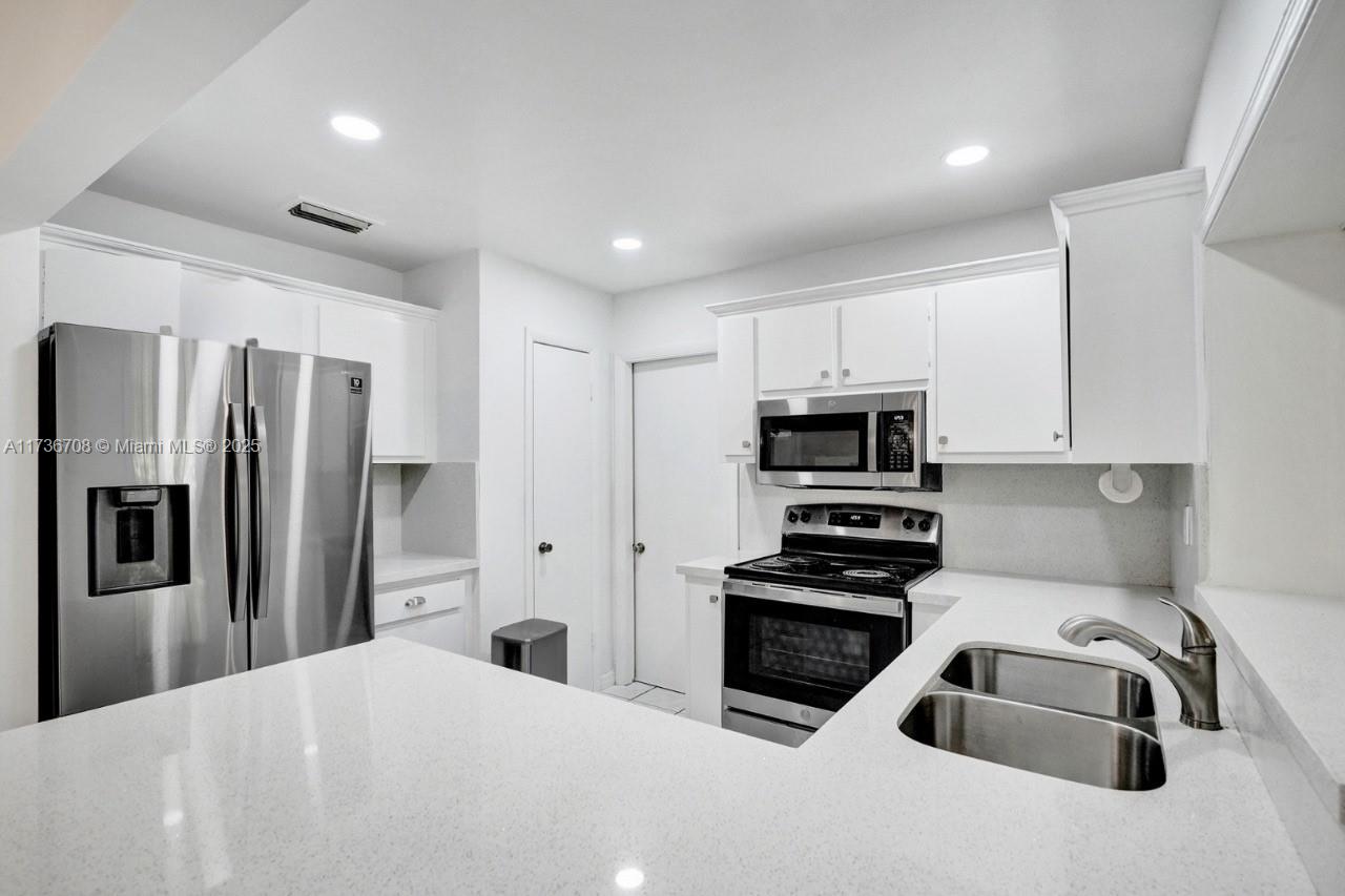 Welcome to 11015 SW 159th Ter, a charming 4-bed, 3-bath home in the heart of Palmetto Estates, Miami. With 2,460 sqft of living space on a 7,501 sqft lot, this home offers spacious rooms and a functional layout. The bright living area flows seamlessly into the large kitchen, perfect for family meals and entertaining. The master suite features a walk-in closet and ensuite bath. The private backyard provides plenty of room for outdoor activities. Built in 1977, this home is well-maintained and ready for move-in. Conveniently located near parks, schools, and major highways, this is the perfect place to call home.