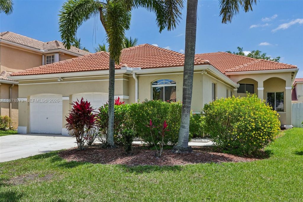 Photo of 1290 Camellia Ln, Weston, FL 33326 (MLS # A11978979)