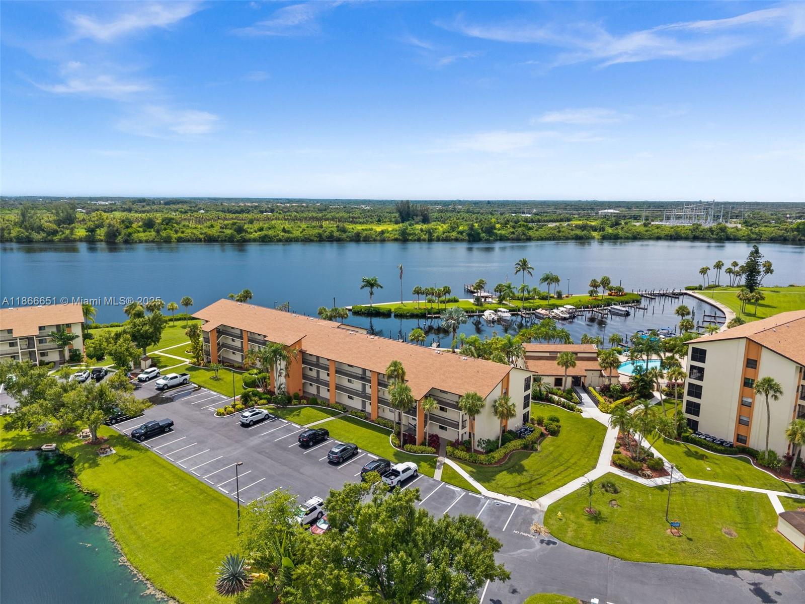 Welcome to Bay Pointe Yacht & Racquet Club, a hidden gem on the Caloosahatchee River. This renovated 2-bedroom, 2-bath ground floor condo offers 1,051 sq. ft. with AMAZING river and marina views. Updates include luxury vinyl plank flooring, coastal paint, upgraded electrical, modern lighting, and a NEW AC (2024). The kitchen has soft-close shaker cabinets, quartz counters, and stainless appliances, while both baths feature contemporary finishes. The primary suite includes a walk-in closet and water views with lanai access. Amenities: heated pool, fitness center, tennis, pickleball, bocce, kayak launch, and fishing pier. Community boat slips with DIRECT Gulf access are available to rent or buy. Set on 27 acres of lush green space, minutes to shopping, dining, and downtown Fort Myers.