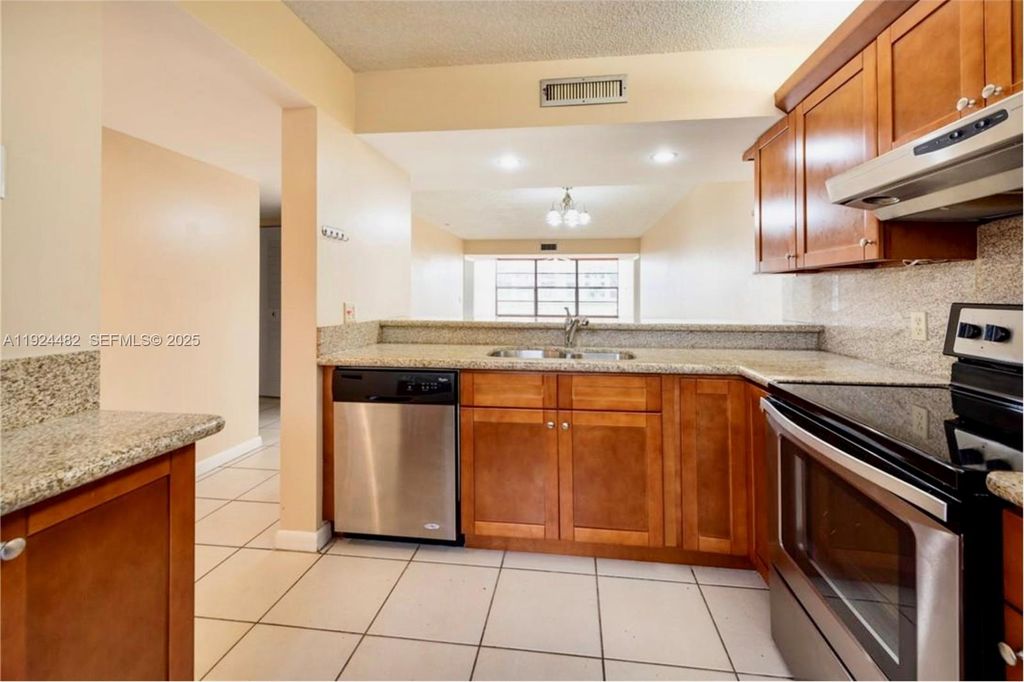 Photo of 1520 Whitehall Dr #101, Davie, FL 33324 (MLS # A11924482)