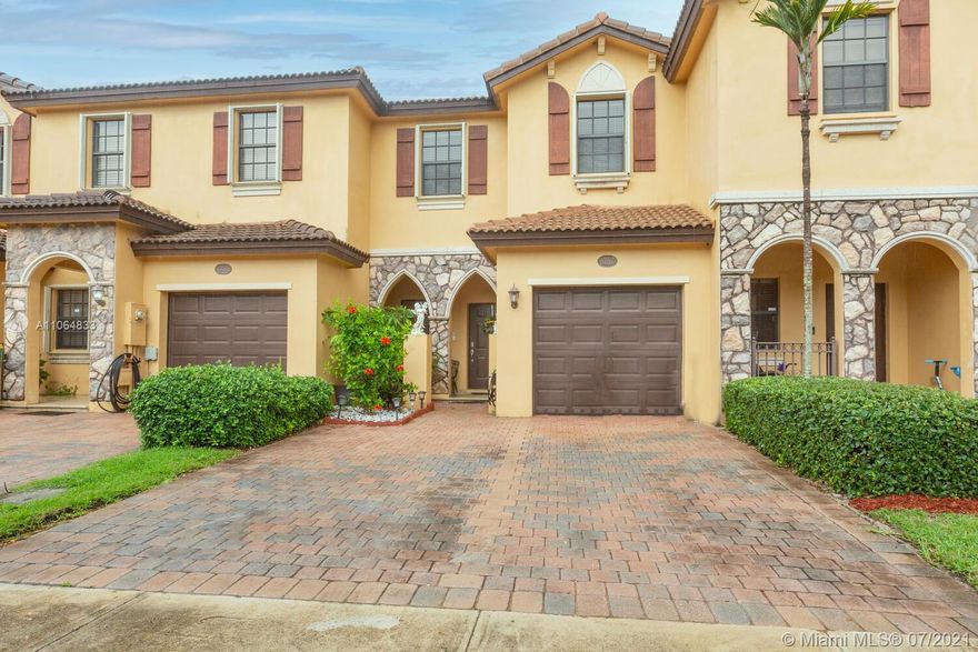 Gorgeous townhome available in the Vineyards community of Umbria! This home features a sacious layout, with formal living room, dining room, and family room downstairs. Upgraded kitchen with Espresso colored cabinets and granite counter tops! All tile floors downstairs and laminate in the master bedroom! Spacious backyard, fully fenced with canal view! Gated community with luxury clubhouse, swimming pool, gym, and children's splash park. Will not last!