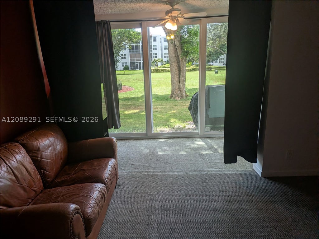 Photo of 9471 Evergreen Pl #106, Davie, FL 33324 (MLS # A12089291)