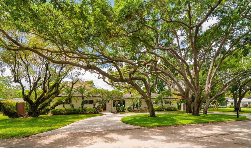 This exceptional 4-bedroom, 2.5-bath home is ideal for comfort, entertaining, and outdoor living. Ideally located near top-rated public and private schools, parks, shops, and bike paths, it is tucked away at the end of a quiet cul-de-sac with minimal road traffic. The spacious primary suite features his-and-hers walk-in closets and an en-suite bath with dual sinks, dual shower heads, and a separate tub. The large kitchen boasts wood cabinetry, granite countertops, and a generous breakfast nook. The open living, dining, and family areas offer easy flow, with disappearing sliding glass doors connecting indoor and outdoor living. Step outside to a covered screened enclosure that helps keep bugs out and enjoy the large patio—perfect for entertaining—with its built-in grill and bar and easy access to the kitchen, plus a sparkling pool for relaxing and fun. The fenced backyard provides added privacy. The home also includes a dedicated laundry room with cabinetry and a utility sink. All windows and doors are impact-resistant, and the home has a concrete tile roof (2019).