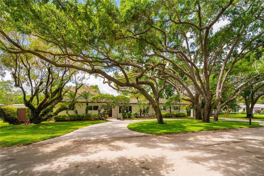 This exceptional 4-bedroom, 2.5-bath home is ideal for comfort, entertaining, and outdoor living. Ideally located near top-rated public and private schools, parks, shops, and bike paths, it is tucked away at the end of a quiet cul-de-sac with minimal road traffic. The spacious primary suite features his-and-hers walk-in closets and an en-suite bath with dual sinks, dual shower heads, and a separate tub. The large kitchen boasts wood cabinetry, granite countertops, and a generous breakfast nook. The open living, dining, and family areas offer easy flow, with disappearing sliding glass doors connecting indoor and outdoor living. Step outside to a covered screened enclosure that helps keep bugs out and enjoy the large patio—perfect for entertaining—with its built-in grill and bar and easy access to the kitchen, plus a sparkling pool for relaxing and fun. The fenced backyard provides added privacy. The home also includes a dedicated laundry room with cabinetry and a utility sink. All windows and doors are impact-resistant, and the home has a concrete tile roof (2019).