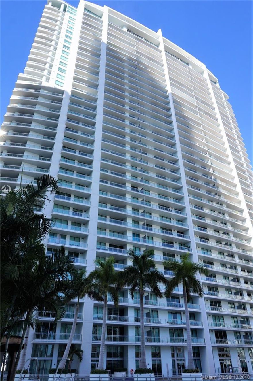 Panoramic views to the city from the 50th floor.  This turn-key one bedroom unit with 1.5 bath features porcelain tile throughout and walls painted in white. Open kitchen with black quartz counter tops & SS appliances. Contemporary furnishing makes this apartment appealing to the most demanding customer. Mint at Riverfront is gated community located at the North side of the Miami river. Amenities includes: resort type pool, gym, spa, valet parking, concierge 24 hrs. A pleasure to show!