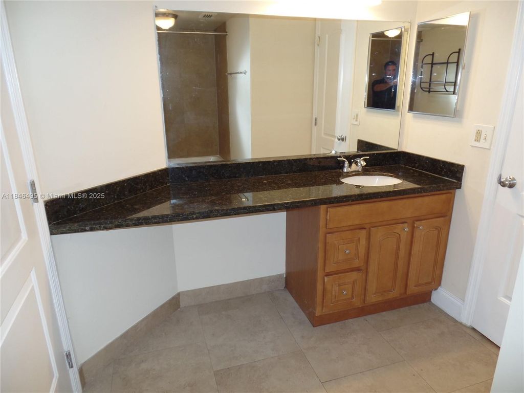 Photo of 2803 N Oakland Forest Dr #308, Oakland Park, FL 33309 (MLS # A11846495)