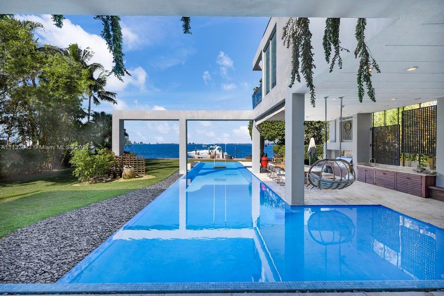 Custom Zen inspired 2 story waterfront private oasis located on the quiet side of Key Biscayne’s most spectacular street, Harbor Drive. Nestled on a 20k sf lot, with 100 ft waterfrontage. Boasting breathtaking unobstructed wide water views of Biscayne Bay and Miami’s Downtown city skyline. Natural light illuminates soaring ceilings and open floor plan. Large Master Suite features private balcony and spa inspired separate shower and soaking tub. Enjoy amazing sunsets from generous covered outdoor living areas and resort style back yard, pool and spa. Opportunity to easily convert to 6 bedrooms. Additional features include media room, elevator and 2 car garage. Designed for those seeking to relax, entertain, and embody all Miami has to offer. Live every day in your own “Aman” style resort.