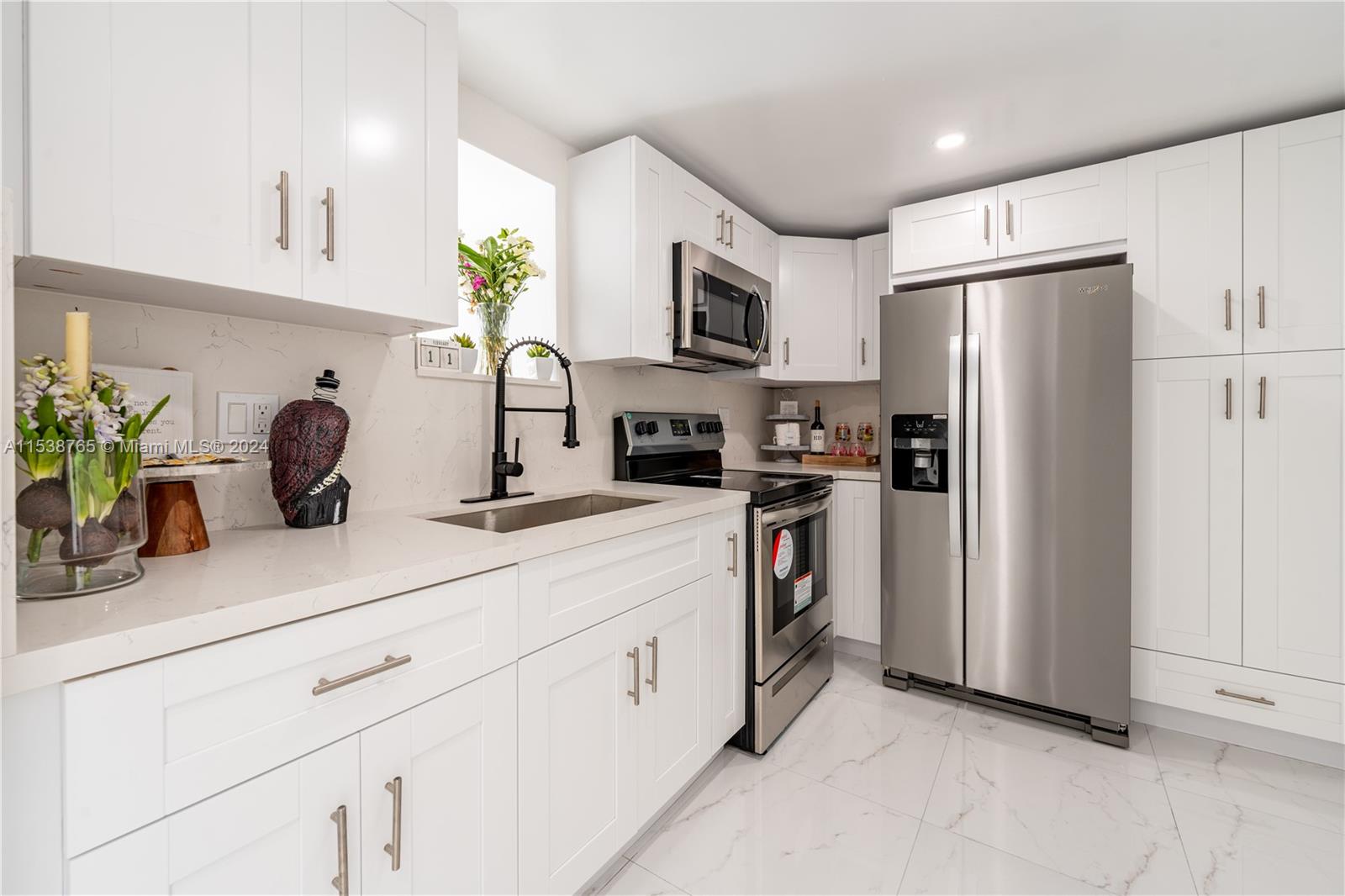 Welcome to your NEWLY RENOVATED, 2-bed, 2-bath condo on the 5th floor in North Miami with breathtaking views and 2 parking spots! Upon entering, you'll find an open-concept living space connected to a modern, BRAND-NEW kitchen with BRAND-NEW stainless steel appliances and sleek countertops, as well as updated floors and BRAND-NEW bathrooms. The living area features natural light and direct balcony access overlooking the pool, perfect for Florida evenings. Just steps from world-class shopping, dining, and entertainment! Extra storage space included.