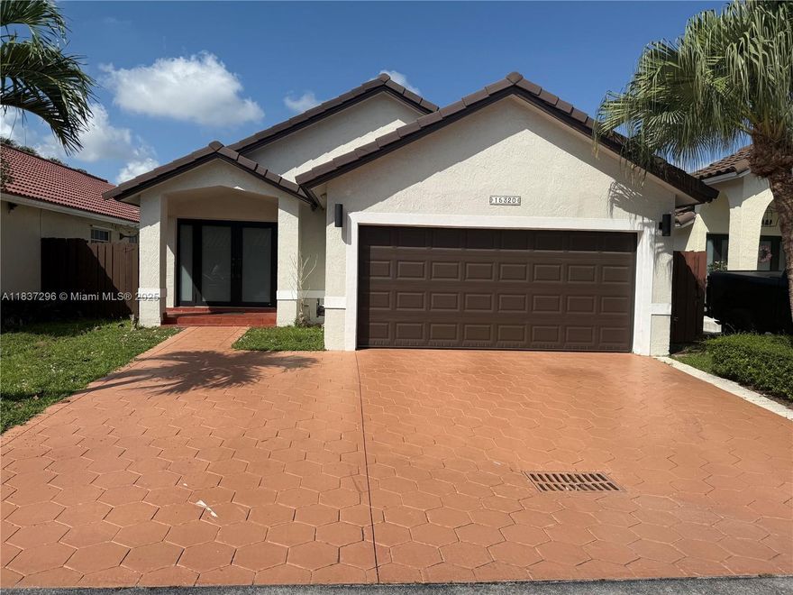 This cozy 3-bedroom, 2-bath home with a den features a two-car garage plus extra driveway parking. It offers four entrances, hurricane-impact windows, and bright white tile floors. Kitchen and baths are original, ready for your touch. Recent upgrades include a 2024 Rheem 5-ton AC (9-year warranty) and new washer/dryer. In a desirable Kendall neighborhood with private security, parks, sports courts, and nearby shops, it’s ideal for those seeking comfort, convenience, and tranquility.Miccosukee golf nearby.