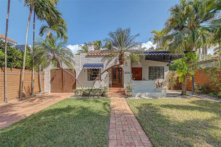 Spanish Beauty with internal courtyard filling the house with light. Nestled on non-flood zone on desirable elegant street in Northeast Coconut Grove! Opportunity to live in Miamis’s favorite residential location! 1 block from bay, walk to marinas, parks, restaurants. European flair one story easy flow with wood floors and high ceilings. Marble bathroom with tub, remodeled kitchen, PVC plumbing, garden water well, mini spa/plunge pool, cheeky hut, Argentinian/Pizza grill and fish pond in a tropical lush backyard with room to grow. Multimillion house neighborhood.  2 bed/1bath + den and mail room in main building, **plus additional 380 sq ft 1bed/1bath guest cottage/ inlaws/ maid quarters/rental unit with separate entrance, W/D and kitchenette! Grandfather in, not included in the sq.ft. An opportunity not to miss. 24 hrs previous appointment required. Only prequalified buyers.