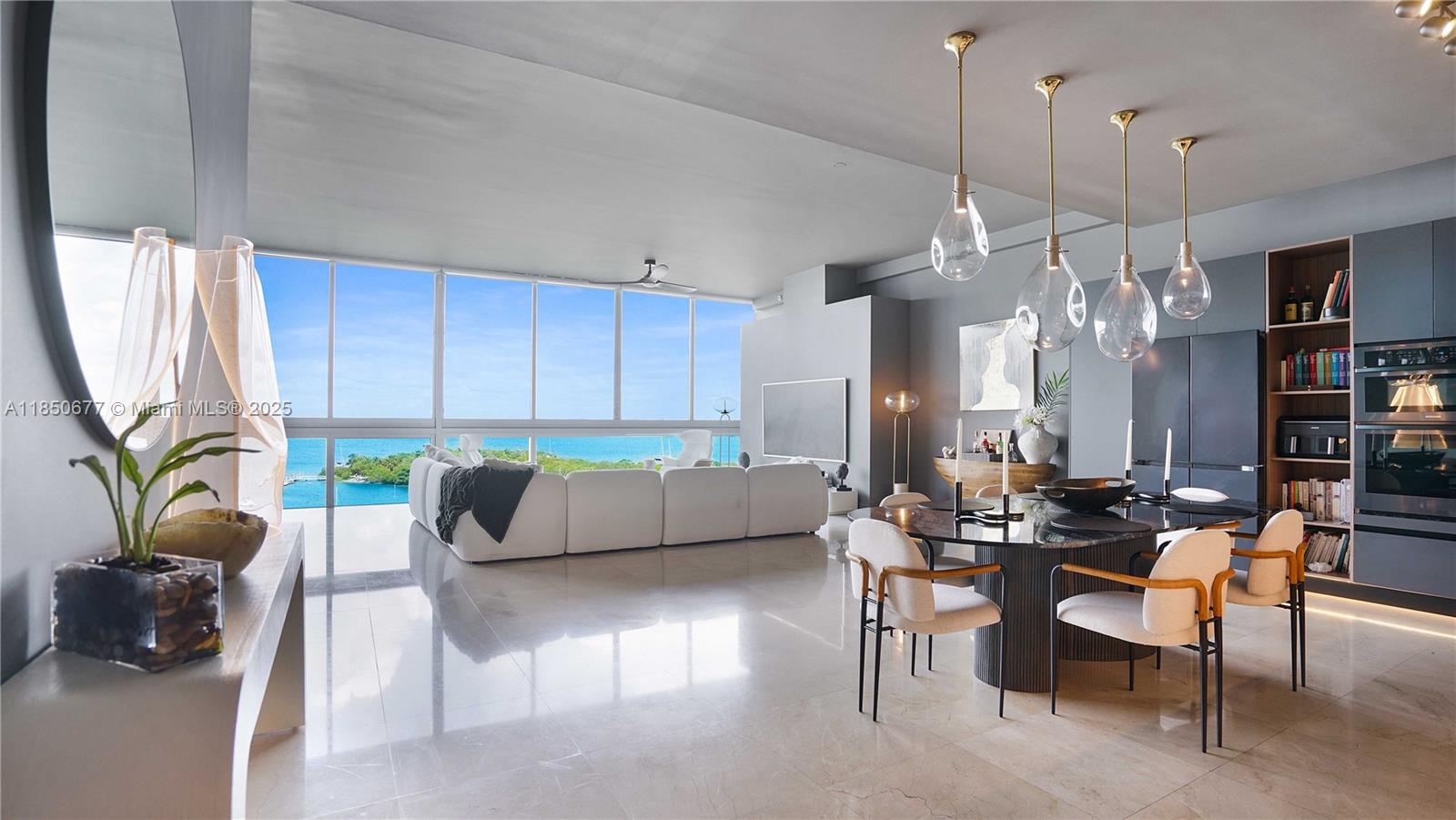 1815sf RENOVATED 2/2 WATERFRONT DREAM LOFT! BAY VIEWS, WATCH DOLPHINS FROM YOUR TUB, AMAZING SUNSETS, & MIAMI SKYLINE. OPEN DESIGNER KITCHEN, 11' CEILINGS, FLOOR TO CEILING & WALL TO WALL WINDOWS w/motorized shades, marble floors. 2 PARKING SPACES, ELECTRIC car charging stations; guest parking. Spacious Master Bath. BOUTIQUE bldg in EXCELLENT FINANCIAL and STRUCTURAL standing, ROOFTOP HEATED POOL & HOT TUB, GYM. Pets OK. NORTH BAY VILLAGE will be home to 6 new high-end, world-renowned residential developments. Nearly $2 billion in new developments including Tula at 7918 West Drive, Shoma Bay and Continuum. Other projects include Pagani Residences, 7913 West Dr Marina View, MG Development & Prosper Group’s waterfront residences. A new North Bay Village Community Center. COME FALL IN LOVE!