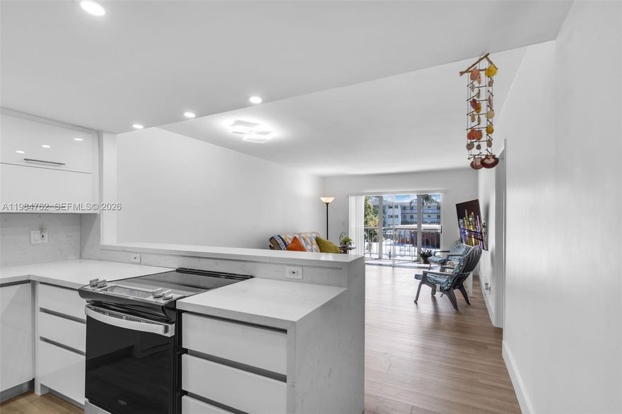 Beautifully updated and move-in ready unit located in the heart of Hollywood! This property features elegant quartz countertops with a convenient bar area, perfect for entertaining, along with modern vinyl flooring throughout for a sleek and low-maintenance finish. The kitchen and bathroom have been fully renovated, offering contemporary design and functionality, complemented by a new shower valve for added comfort.Enjoy peace of mind with a newer A/C system installed in 2022. The unit also includes a custom-built closet with plywood and mica finishes, maximizing storage and organization. Optional furnishings such as a full-size adjustable bed and futon may be included in the sale, providing a turnkey opportunity for buyers or investors.The community offers a unique 1.5-mile bi-level walking path, ideal for outdoor enjoyment and an active lifestyle. Centrally located near hospitals, major highways, shopping centers, restaurants, and entertainment, with everything you need just minutes away. A perfect place to call home or an excellent investment opportunity!