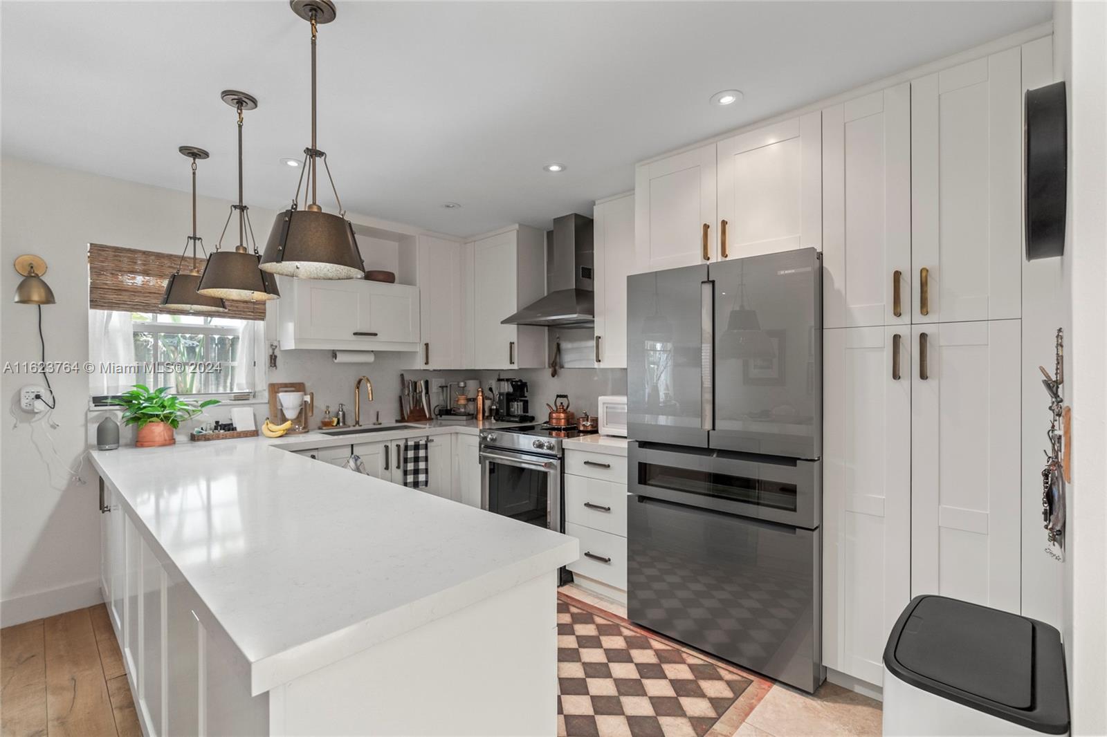 Welcome to a private, gated townhome community in the heart of Coconut Grove. This elegant upgraded residence boasts French reclaimed wood floors throughout the ground floor that open to a luxurious private patio setting and just beyond is the community pool. The modern kitchen boasts high-end appliances and sleek finishes with white wood cabinets & quartz countertops. Upstairs offers 3 bedrooms with an additional loft room and bamboo wood flooring throughout. Pristine condition, roof replaced in 2019, windows and French doors are impact glass. AC replaced in 2021, 1 car garage and an additional parking space adjacent to townhome entrance. Close distance to everything Coconut Grove, Miami has to offer. restaurants, parks, shopping, salons, & marina.