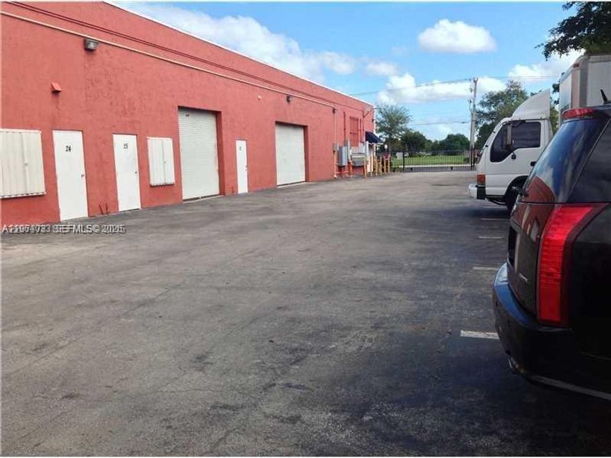 Well-maintained industrial/flex space ready for immediate occupancy. This unit features three private offices, one full bathroom, and approximately 700 SF of warehouse area with a front-loading roll-up door and access from both the front and rear of the building. The space is ideal for a variety of light industrial or business uses. HOA includes water, roof, and insurance. Seller is willing to sell the existing sign business inventory separately (not included in the purchase price). Conveniently located near Florida’s Turnpike, Tamiami Airport, and shopping centers.