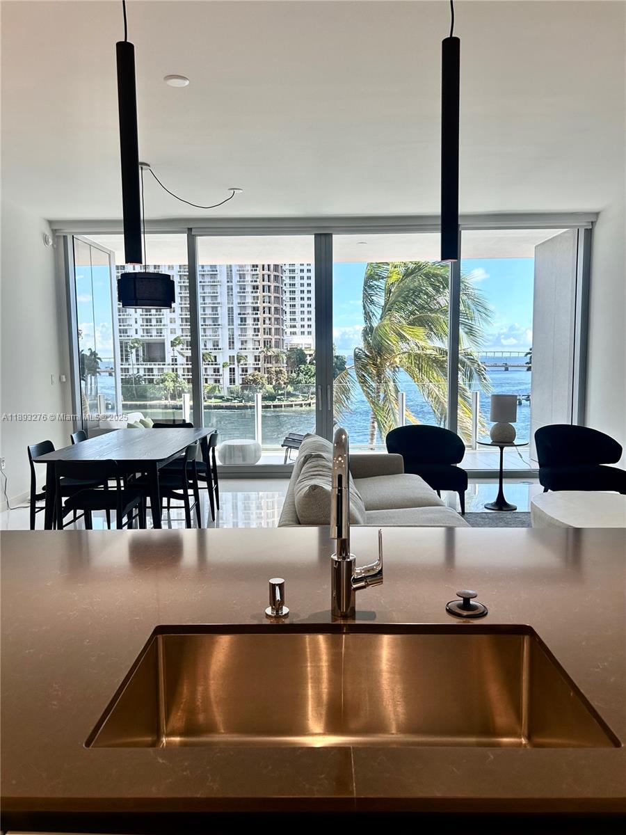 Aston Martin Residences Miami is a luxury residential tower located at 300 Biscayne Boulevard Way. Developed by G and G Business Developments, this 65-story skyscraper features 391 high-end condominiums with designs inspired by the iconic Aston Martin brand. Residences offer expansive layouts, floor-to-ceiling windows, and top-tier finishes. Amenities include a state-of-the-art 2 floor wellness center, a sky deck with a pool, and more. The building’s sleek, modern design and prime waterfront location make it a prestigious address in Miami’s vibrant downtown area