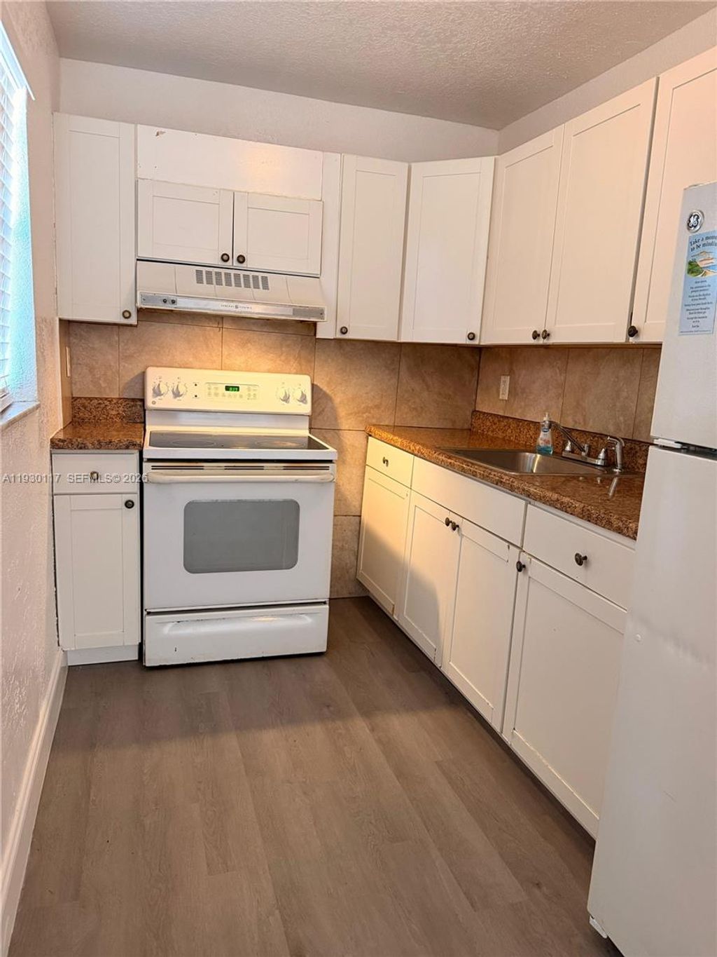 Photo of 1123 NW 27th Ave #1, Fort Lauderdale, FL 33311 (MLS # A11930117)