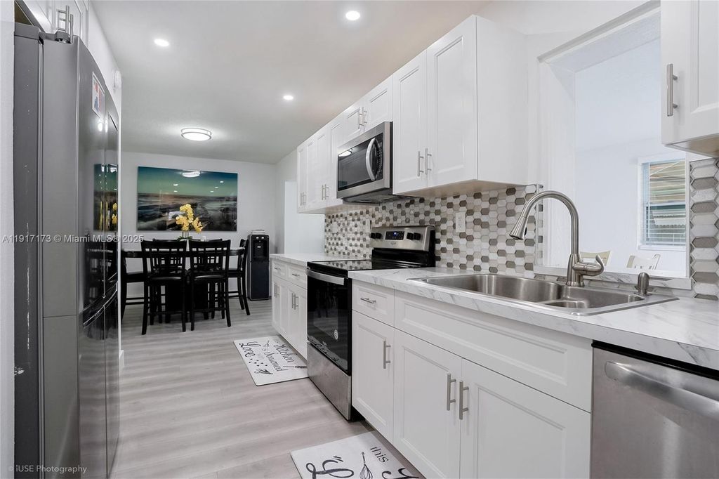 Photo of 1211 NW 50th Ave, Lauderhill, FL 33313 (MLS # A11917173)