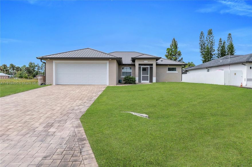 Beautiful 2023-built home with a metal roof and a peaceful canal view, situated on an oversized 0.34-acre corner lot in Lehigh Acres. This modern 4-bedroom, 2-bath residence features an open-concept layout with tile throughout, high ceilings, and abundant natural light. The kitchen offers quartz countertops, stainless steel appliances, and sleek contemporary cabinetry. Enjoy Florida living from the screened lanai overlooking the canal and a spacious backyard with room for a pool, plus a sprinkler system for easy maintenance. Move-in ready and like new. Seller is motivated and offering concessions—don’t miss this great opportunity! Easy to show.