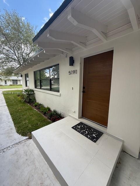 This charming corner-lot home in South Miami perfectly balances timeless character with modern upgrades. A brand-new A/C unit installed in 2024 ensures year-round comfort, while elegant beige flooring and thoughtful renovations enhance the interior. The home features three bedrooms plus a private home office, two full bathrooms, and a garage with washer and dryer. A spacious open layout includes an eat-in kitchen and formal dining area, ideal for both everyday living and entertaining. The covered sunroom and patio open to a massive backyard, creating the perfect indoor-outdoor lifestyle. Ideally located just minutes from the University of Miami and Coral Gables, this home offers the perfect blend of historic charm, modern convenience, and a prime South Miami location.
