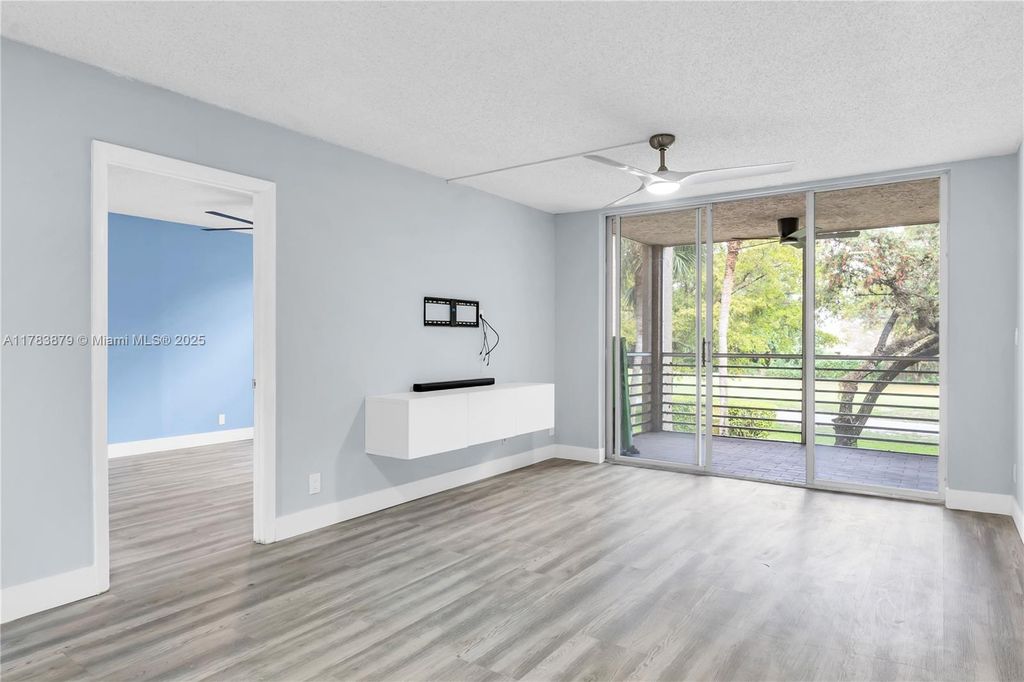 Photo of 9460 Tangerine Pl #202, Davie, FL 33324 (MLS # A11783879)