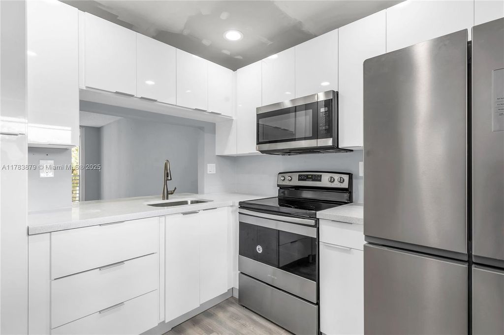 Photo of 9460 Tangerine Pl #202, Davie, FL 33324 (MLS # A11783879)