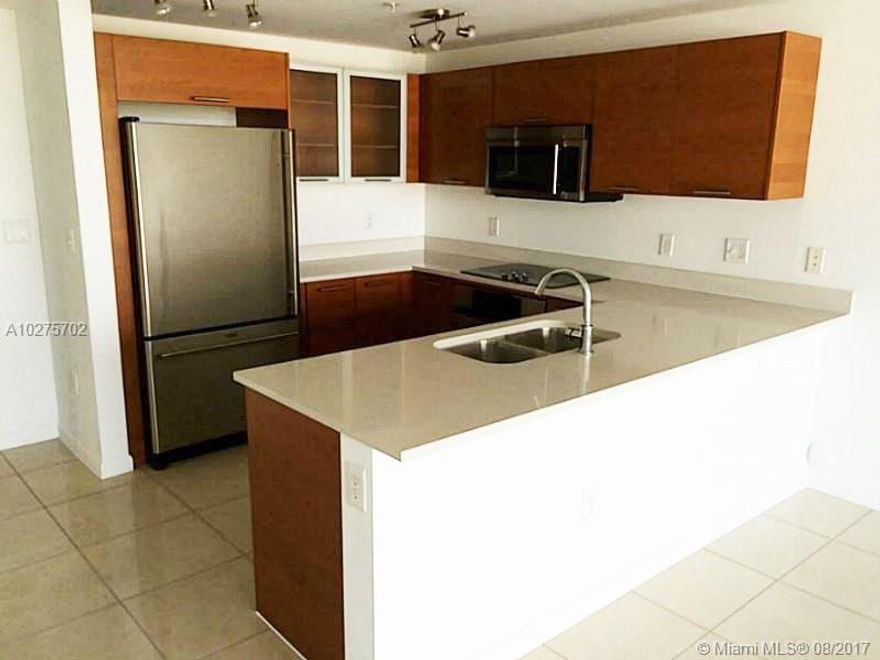 UNIQUE & SPECTACULAR 2 STORY TOWN HOME IN MIDTOWN'S MIDBLOCK CONDO.  TOP OF THE LINE KITCHEN, PORCELANATO FLOORING AND LOTS OF MODERN EXPOSED CONCRETE ADD TO THE MODERN FEEL AND LAYOUT.  THIS HOME BOASTS 3 PRIVATE BALCONIES, LANAI LEVEL ACCESS TO AMENITIES, AND A GENEROUS LIVING SPACE GENEREALLY NOT FOUND IN CONDOS.  AT THE GROUD LEVEL, YOU'RE JUST STEPS AWAY A SCORE OF GREAT EATERIES & SHOPPING.