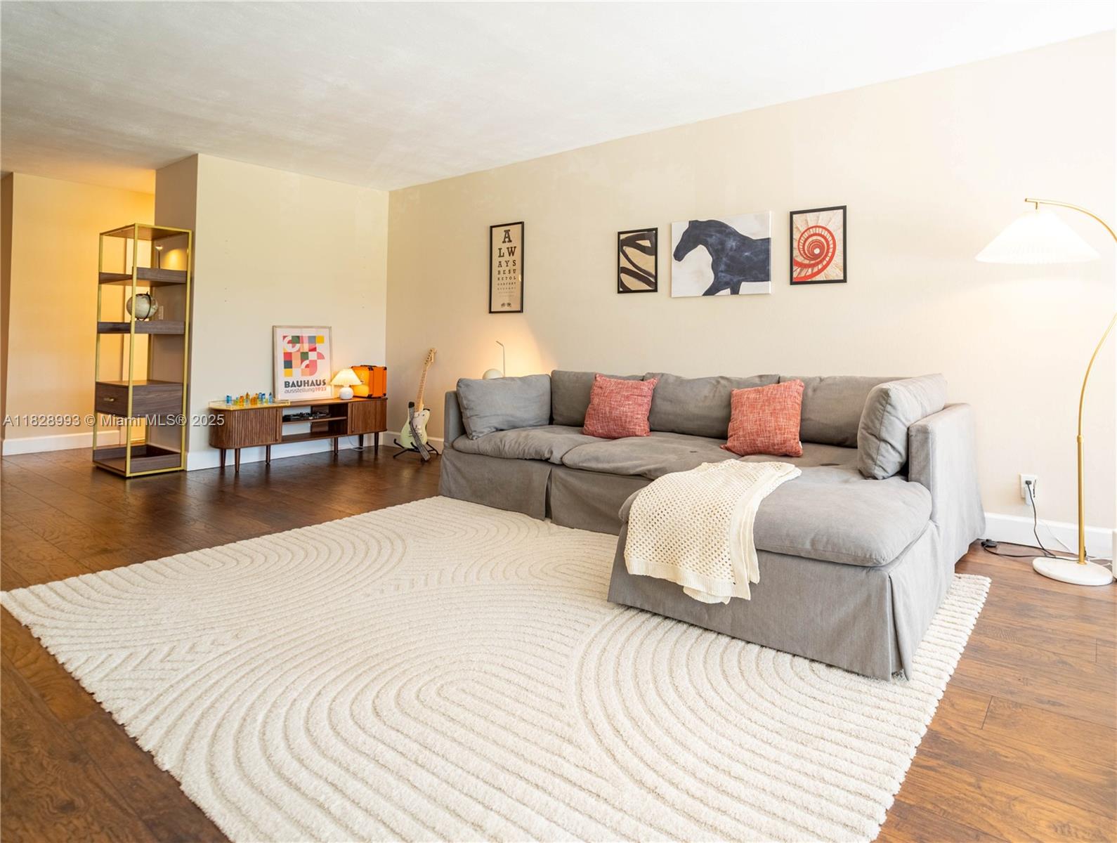 Beautifully bright and spacious 2BR/2BA corner condo in the heart of Plantation, offering 1,350 sq ft of open living space filled with natural light. Enjoy an updated kitchen with ample cabinet space, large living/dining area, and two oversized bedrooms with walk-in closets. Relax on your screened balcony with views of the tree-lined street — even watch City Parades right from your own home. Additional features include in-unit laundry and assigned parking. Quiet, well-kept building with pool, clubhouse, elevator, and lush green spaces. Just steps from Publix, Starbucks, parks, cafes, top schools, and I-595. Easy to show with 24-hour notice.