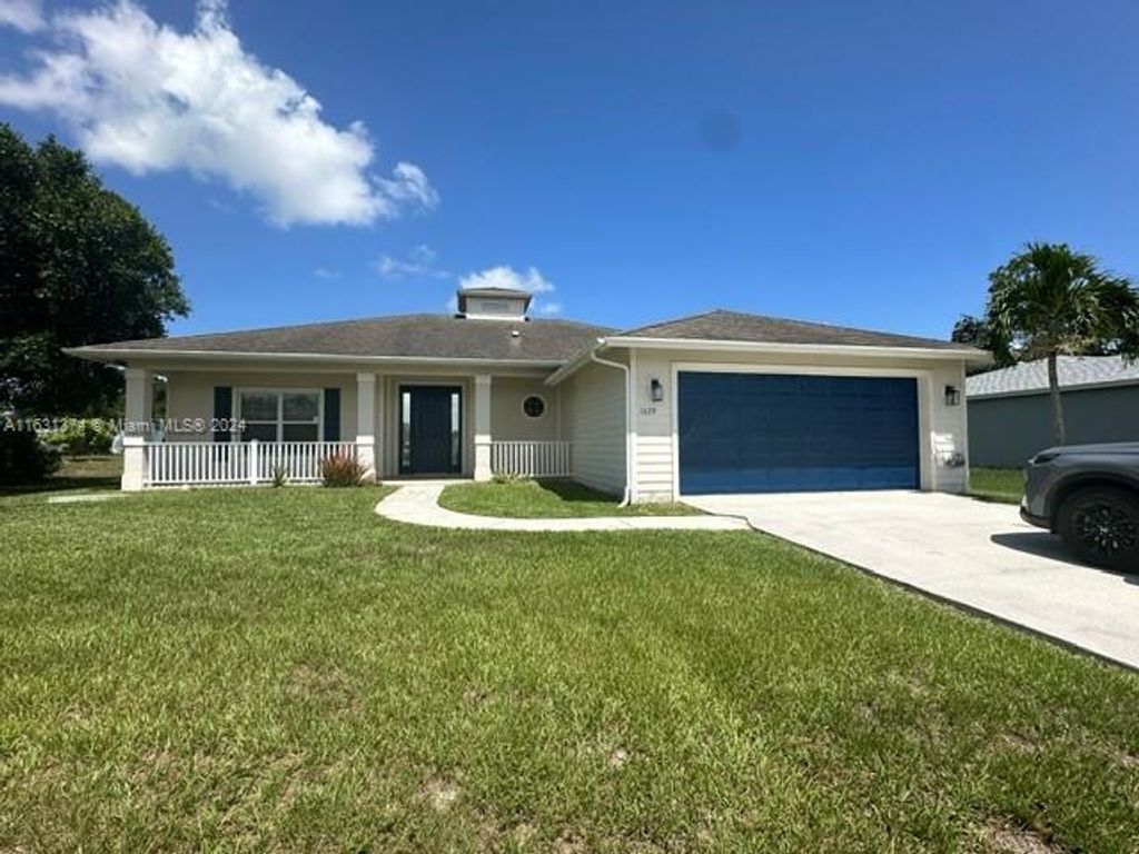 Photo of 1679 SW California Blvd, Port Saint Lucie, FL 34953 (MLS # A11631374)