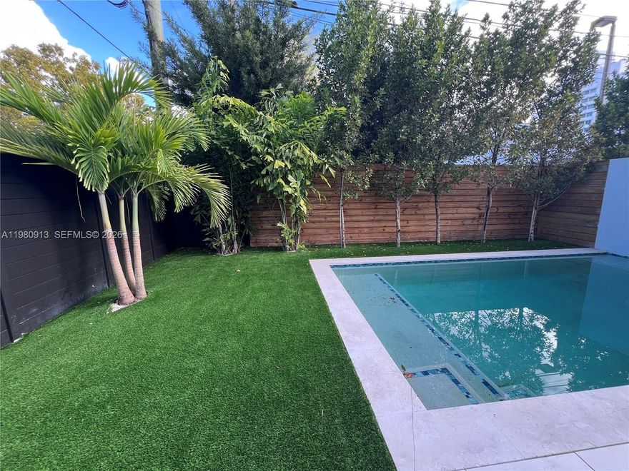 Brand new modern townhouse in the heart of Shenandoah offering 4 bedrooms and 3 bathrooms with approximately 2,400 SF of living space. Bright open floor plan with high ceilings, porcelain floors, and floor-to-ceiling impact windows that bring in abundant natural light. Contemporary Italian-style kitchen with waterfall island, custom cabinetry, and premium appliances. Spacious bedrooms upstairs including a large primary suite with dual sinks, walk-in closet, and separate tub and shower. Private backyard with pool and wood privacy fence, perfect for entertaining. Impact windows and doors throughout. Prime location just minutes from Brickell, Coconut Grove, Coral Gables, and Downtown Miami.