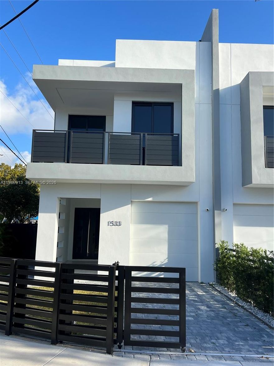 Brand new modern townhouse in the heart of Shenandoah offering 4 bedrooms and 3 bathrooms with approximately 2,400 SF of living space. Bright open floor plan with high ceilings, porcelain floors, and floor-to-ceiling impact windows that bring in abundant natural light. Contemporary Italian-style kitchen with waterfall island, custom cabinetry, and premium appliances. Spacious bedrooms upstairs including a large primary suite with dual sinks, walk-in closet, and separate tub and shower. Private backyard with pool and wood privacy fence, perfect for entertaining. Impact windows and doors throughout. Prime location just minutes from Brickell, Coconut Grove, Coral Gables, and Downtown Miami.