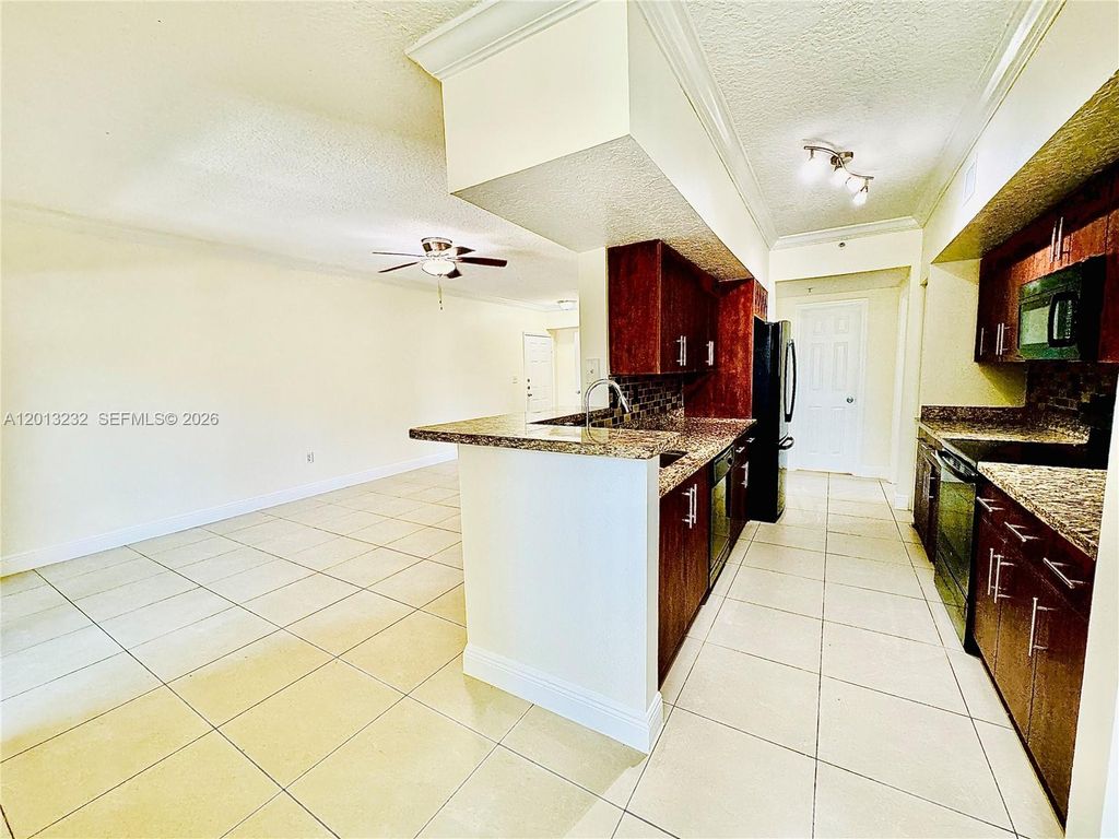 Photo of 220 SW 116th Ave #15207, Pembroke Pines, FL 33025 (MLS # A12013232)
