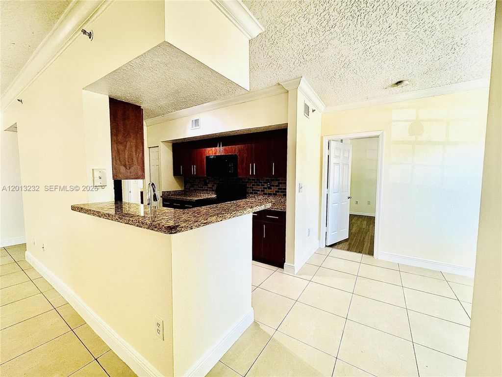 Photo of 220 SW 116th Ave #15207, Pembroke Pines, FL 33025 (MLS # A12013232)