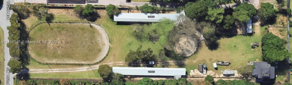 SELLER FINANCING AVAILABLE. Discover the allure of this stunning 2.5-acre haven complete with horse stalls. Currently, a two-story single-family residence is in the making, crafted with a sturdy steel frame, insulated aluminum walls, and hurricane-resistant high-impact windows and doors. Inside, you'll find approximately 1,600 square feet of living space, featuring two brand new showers and a state-of-the-art air conditioning system. Step onto the beautiful decks, where you can soak in breathtaking views of the lush landscape and pristine grounds. This property enjoys a prime location near the Metro Zoo and major highways, offering endless possibilities to bring your dream home to life. Seller financing Available.