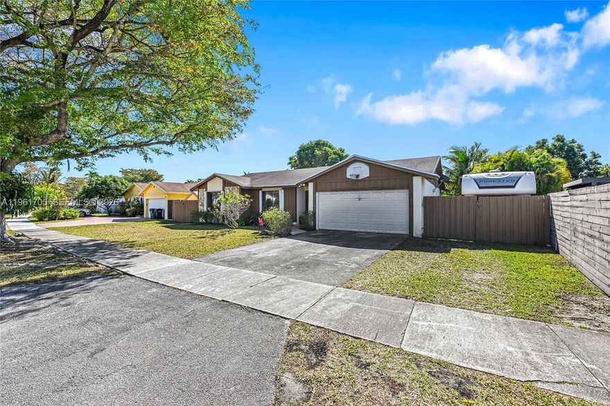 Well-maintained 3-bedroom, 2-bath home featuring a 2-car garage and a private backyard oasis with pool, tiki hut, and covered terrace—perfect for entertaining. Spacious side yard offers room for an RV or boat. Complete accordion shutters provide full hurricane protection. Major updates include a newer roof and an A/C installed in 2021. No HOA. Conveniently located near shopping, dining, and major roadways. Plenty of parking for family and friend get-togethers.