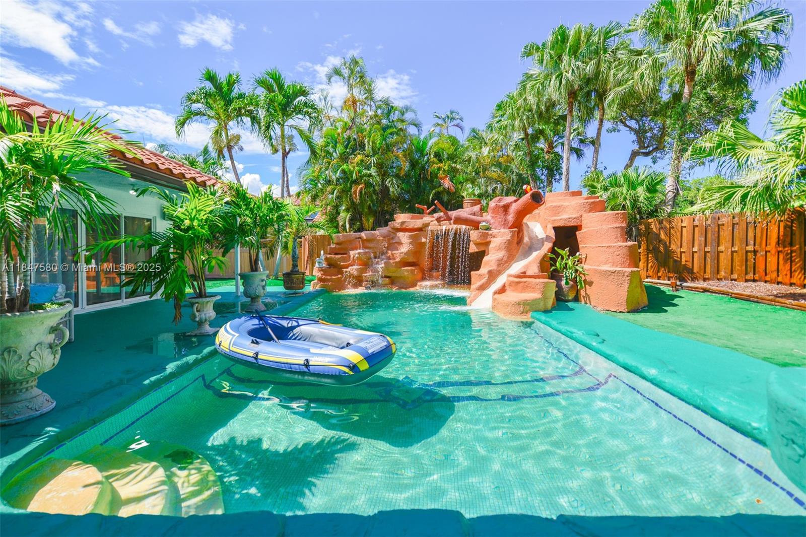 The most exciting and unique house you have ever seen! Exciting Resort style “Water Park” back yard with an amazing water slide, and huge incredible water falls, that cascade down a two beautiful rock walls.But wait!There is also a Pickle-ball/Tennis/Badminton Court with a basketball hoop court.Huge windows with views of this professionally landscaped tropical paradise with beautiful palm trees surround the whole house.Beautifully renovated all new bathrooms and the master bathroom has a Jacuzzi Jet spa tub.Virtually new stainless appliances including new LG extreme hi heat stainless stove and refrigerator stainless dishwasher,two microwaves and new LG washer and dryer. New A/C units 5 years ago and ducts cleaned New Hayward salt water treatment pool system and maintenance free landscape.