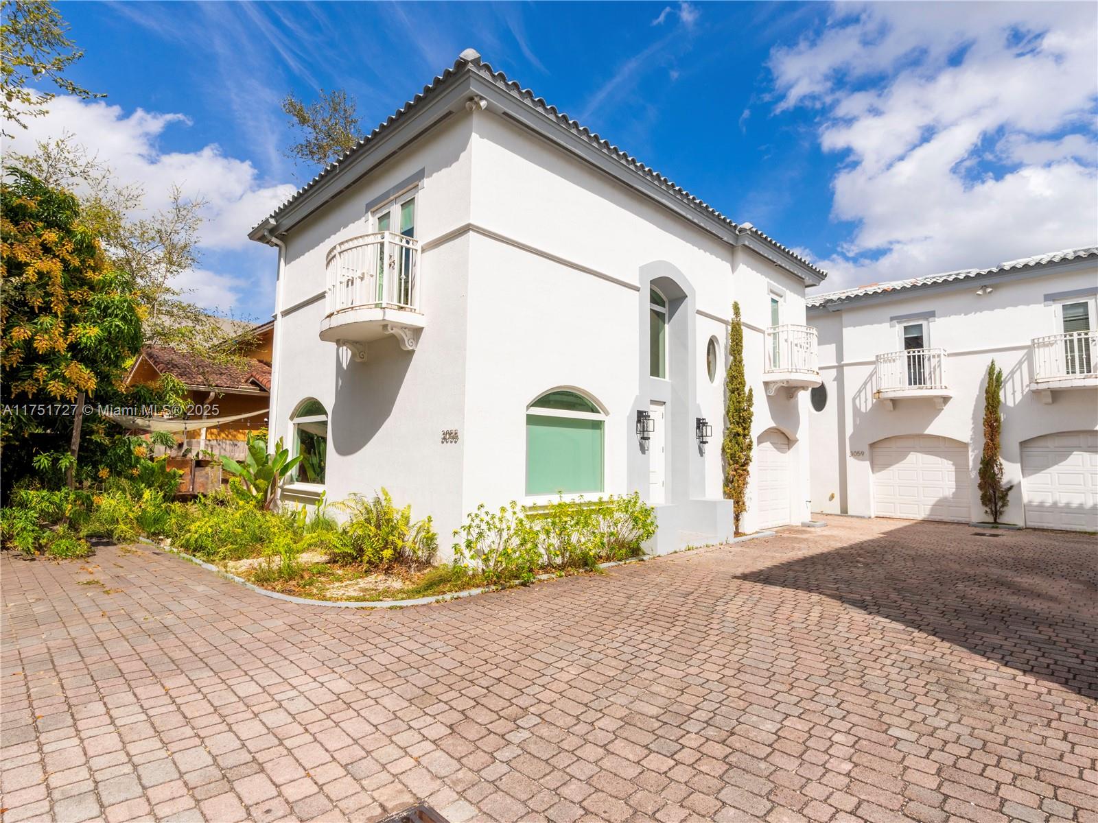 Enjoy the trendy style of Coconut Grove living in this updated 3-bedroom, 2.5-bath townhome with high ceilings and a flowing layout that transitions seamlessly between spaces.
With a renovated kitchen, custom cabinetry, and a spacious island, this home offers both style and functionality, perfect for cooking, dining and entertaining. Situated in a gated community of only four townhomes and surrounded by beautiful new homes, you will be able to walk to Coconut Grove’s vibrant dining, shopping, and parks. With a garage attached and very low HOA fees, this townhome offers a rare opportunity to own in one of Miami’s most desirable neighborhoods.
