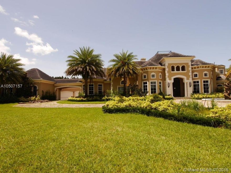 Custom estate home in the heart of Southwest Ranches! Meticulously planned layout with grandiose touches throughout.  Gated community, privately gated driveway offer the upmost privacy. Gourmet kitchen features top of the line appliances, spectacular media room with ticket booth, master wing built for royalty. Guest quarters & 6 car garage. Guest/Maid quarters. Marble floors span throughout. One of a kind!