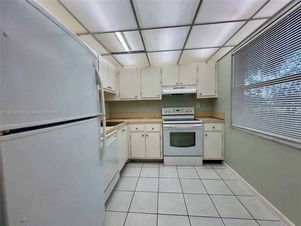 Photo of 3101 NW 47th Ter #228, Lauderdale Lakes, FL 33319 (MLS # A11855301)