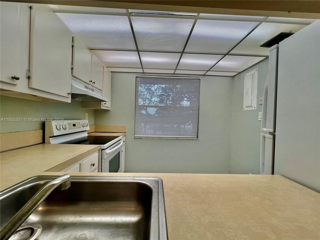 Photo of 3101 NW 47th Ter #228, Lauderdale Lakes, FL 33319 (MLS # A11855301)