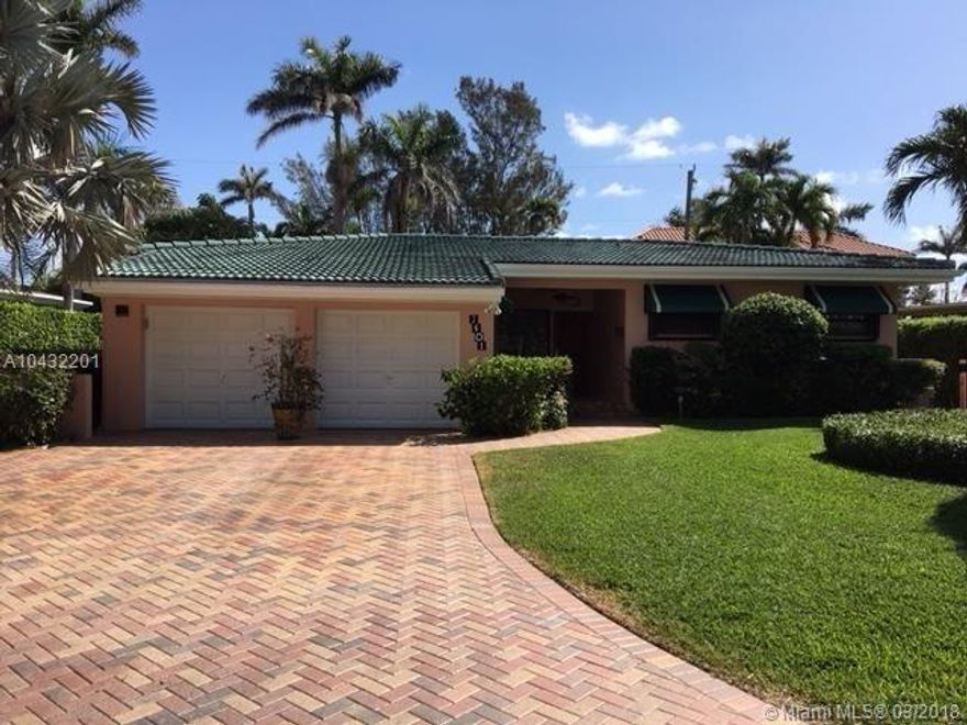 Beautiful spacious home in North Bay Village. 3BR 2BTH in quiet guard gate community of well maintained single family homes. Light & bright. Spacious MBR w/end to end chest of drawers. All closets w/built in shelves. Bathrooms ADA compliant. Heated towel racks. Bright kitchen w/breakfast area. Formal dining area. Cozy sitting area off LR. FR w/bar ideal for watching TV, board games. Pretty backyard is a flower garden w/sitting area for a romantic al fresco candlelight dinner. Propane BBQ included. 2car garage w/potential for 4th BR. Impact windows & hurricane shutters throughout. Garage doors hurricane rated.  Newly painted exterior. Paved driveway room for 3 cars! Barrel tiled roof. Exterior lighting. Beautiful orchids in front yard add to curb appeal. Watch a 3D Virtual Tour! Make Offer!