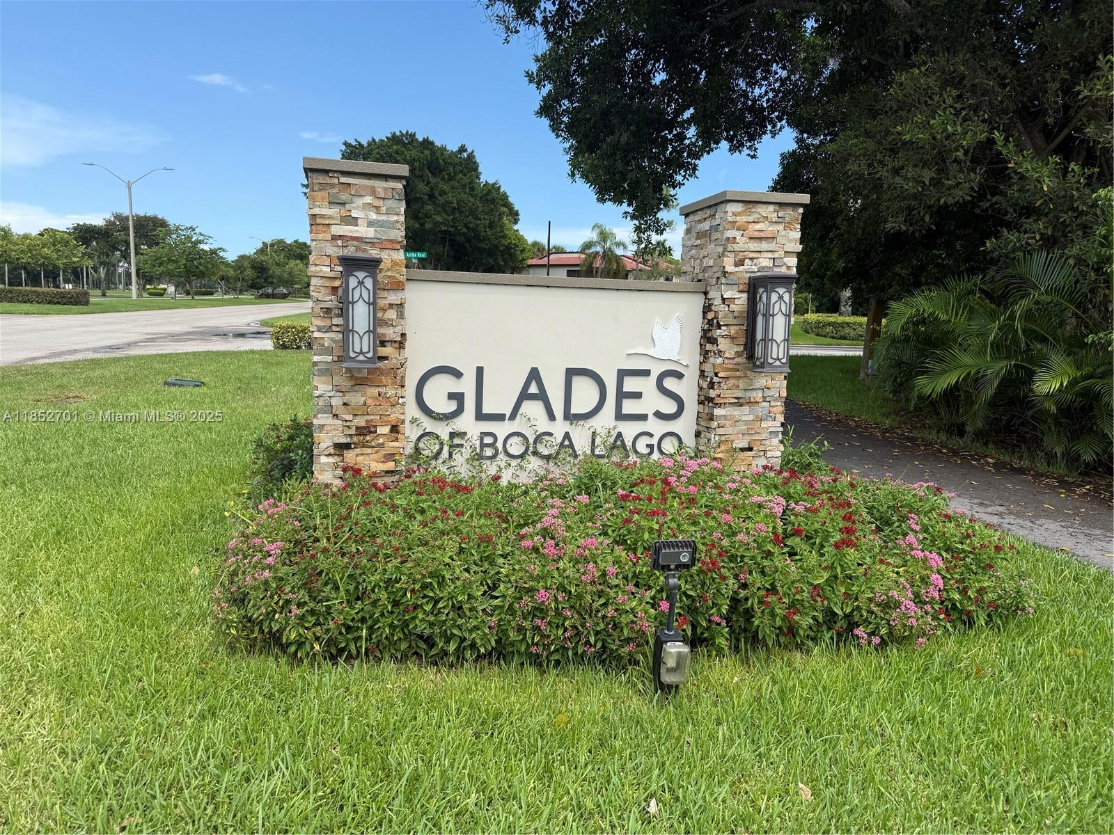 Rarely available 1,856 Sq Ft corner villa in the prestigious 55+ community of Boca Lago. This spacious and elegantly renovated 2-bedroom, 2-bathroom villa offers an open layout.
Large master suite features a walk-in closet, powder area, bathroom with Roman tub and separate shower. Large second bedroom ,walk-in closet, access to a private patio. A nearby ¾ bath serves both guests and the second bedroom. Updated kitchen with granite countertops, SS appliances, in-kitchen laundry area with full-size washer and dryer. Vaulted ceilings open up the living and dining areas, which flow into an enclosed L-shaped porch with floor-to-ceiling windows—offering breathtaking views of the lake and lush manicured lawns. New tiled roof. Long driveway and incosed carport. maintenance 911 .In Glades