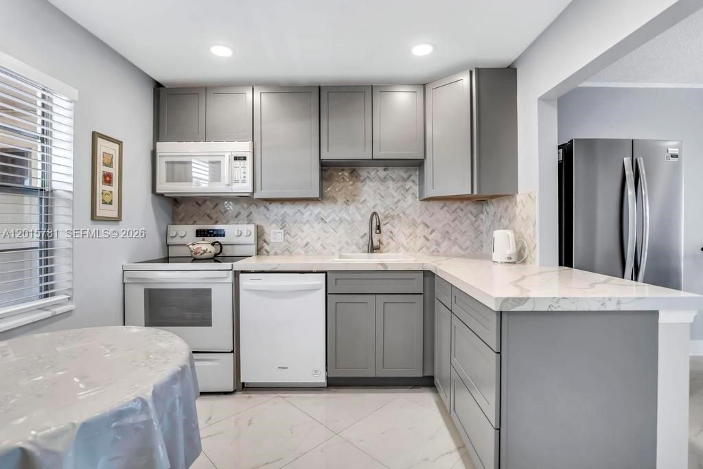 Photo of 1020 Country Club Dr #405, Margate, FL 33063 (MLS # A12015781)